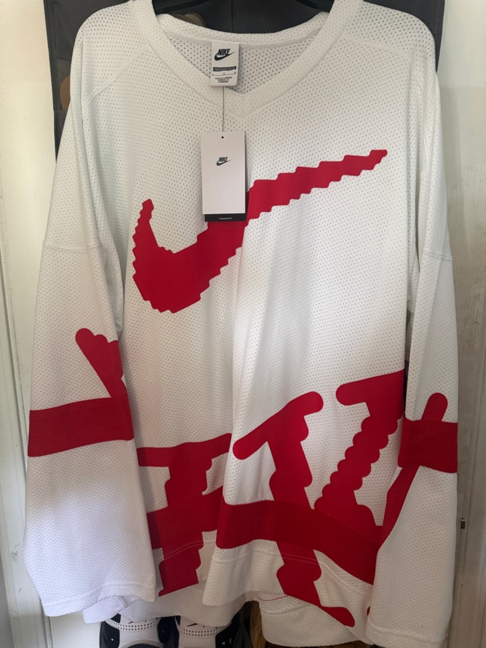 Nike White Mesh Oversized Jersey with Red Graphic Swoosh